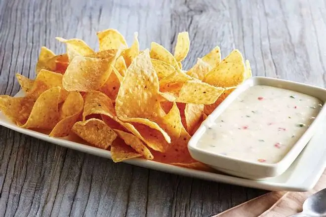 Order White Queso Dip & Chips food online from Applebee's Grill + Bar store, Fayetteville on bringmethat.com